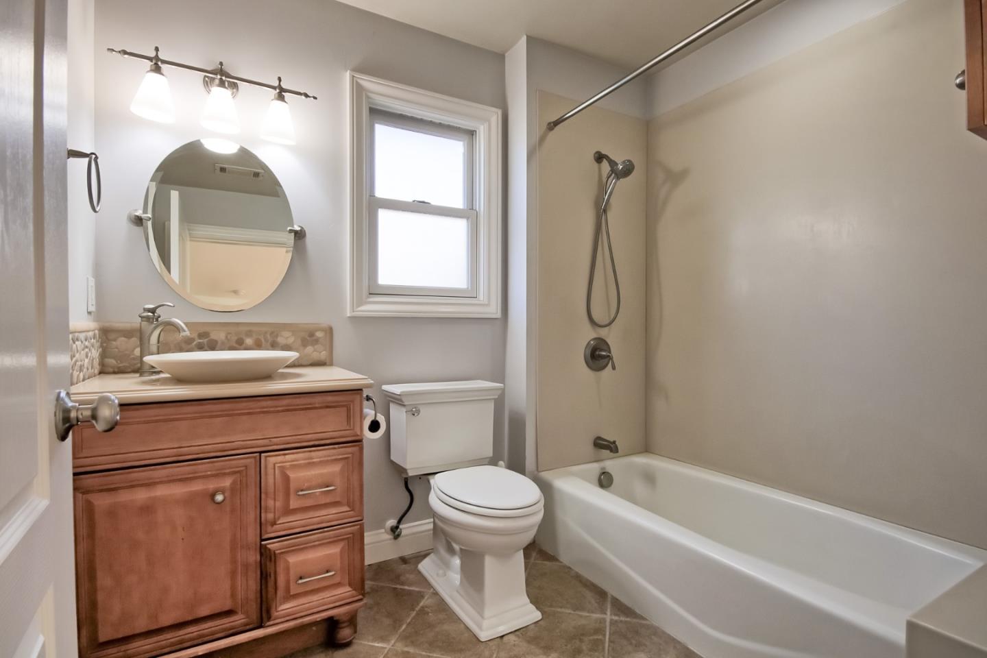 22305 Montera Drive Salinas, CA 93908 - Photo 15 of 20 a bathroom with a toilet sink vanity tub and shower