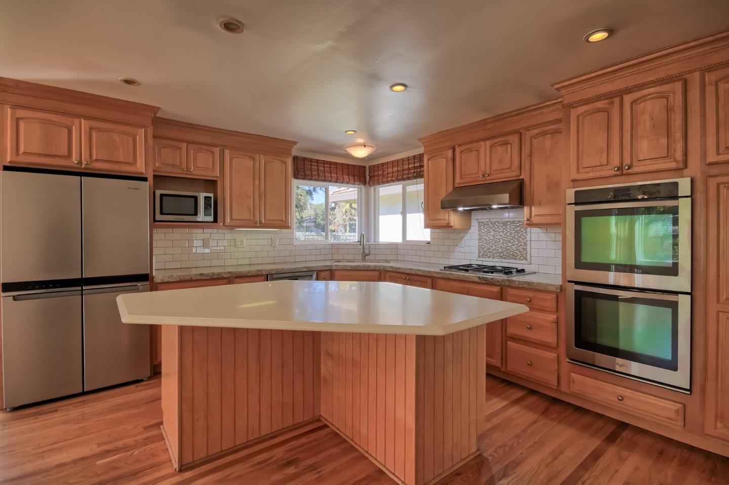 22305 Montera Drive Salinas, CA 93908 - Photo 4 of 20 a kitchen with kitchen island a counter top space a sink stainless steel appliances and cabinets