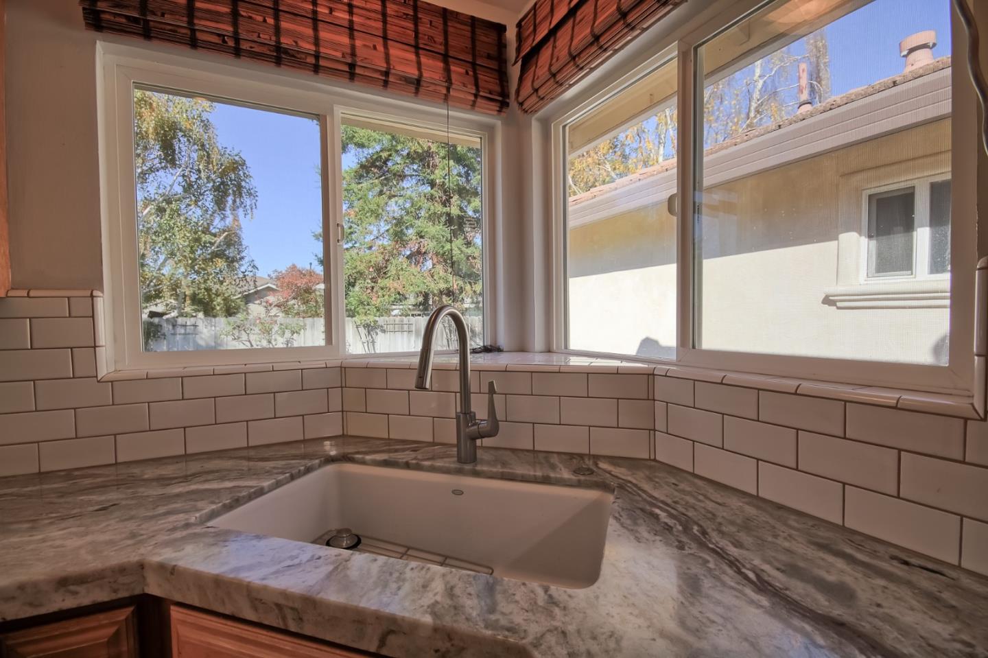 22305 Montera Drive Salinas, CA 93908 - Photo 5 of 20 a bathroom with a granite countertop sink and a window