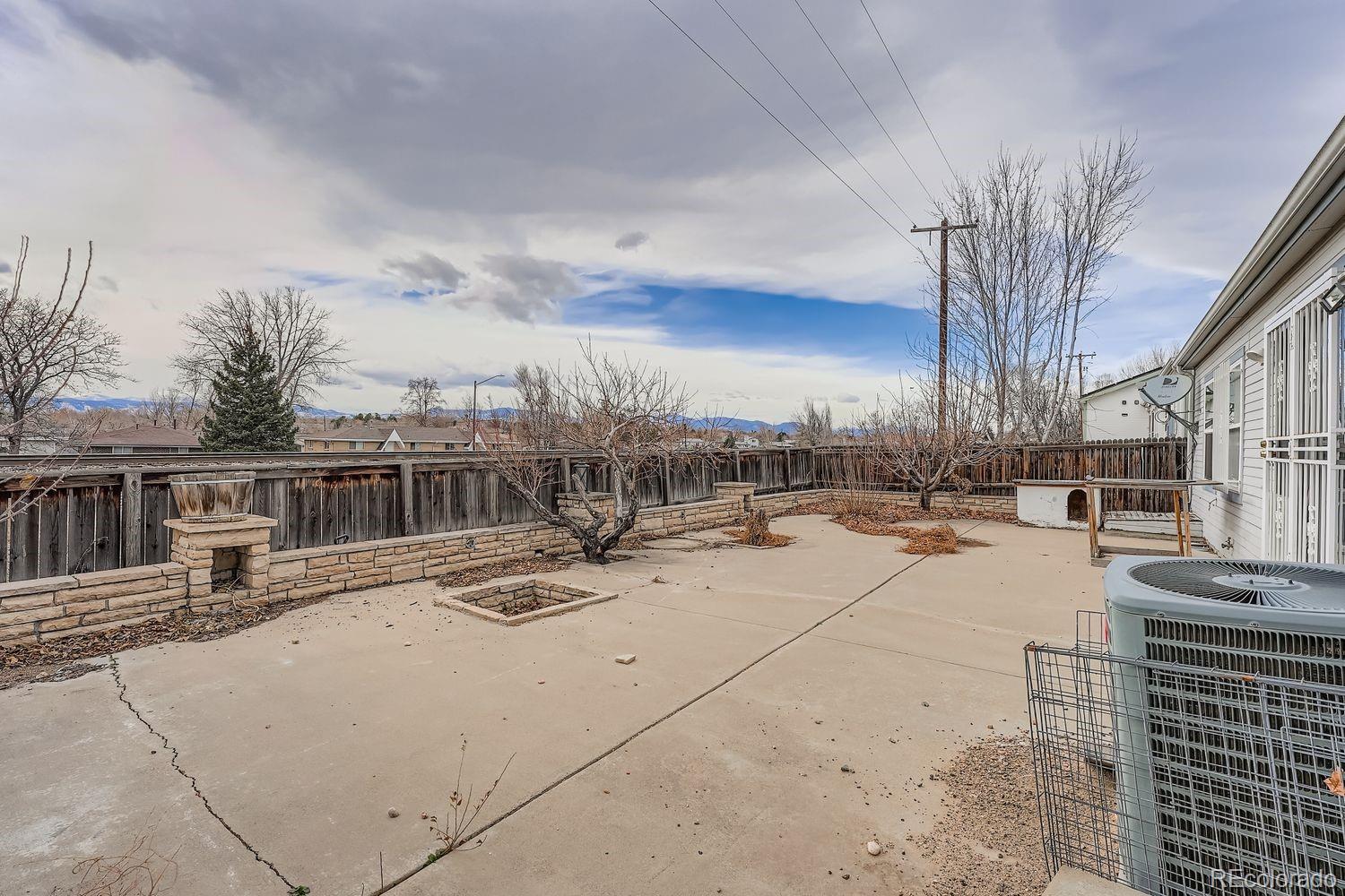 7393 Raleigh Street Westminster, CO 80030 - Photo 20 of 22 a view of a terrace with kitchen