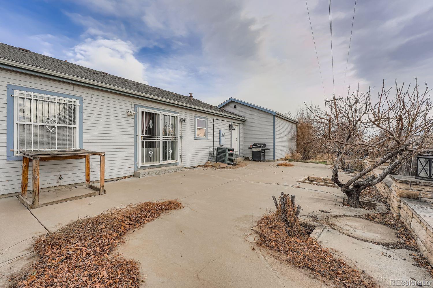 7393 Raleigh Street Westminster, CO 80030 - Photo 22 of 22 a front view of a house with a yard and balcony
