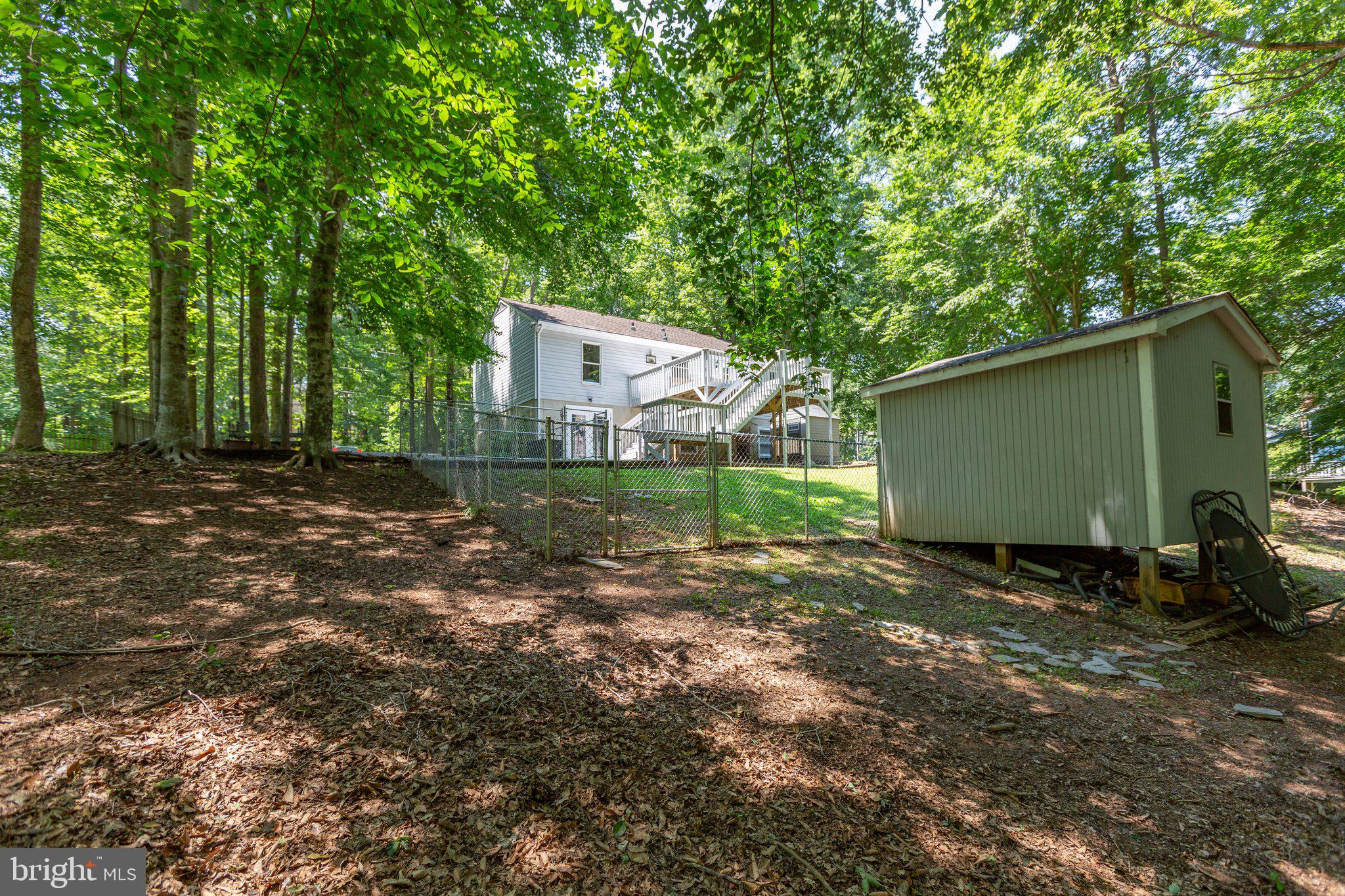 228 Cedar Ridge Drive Ruther Glen, VA 22546 - Photo 45 of 77 a backyard of a house with lots of green space