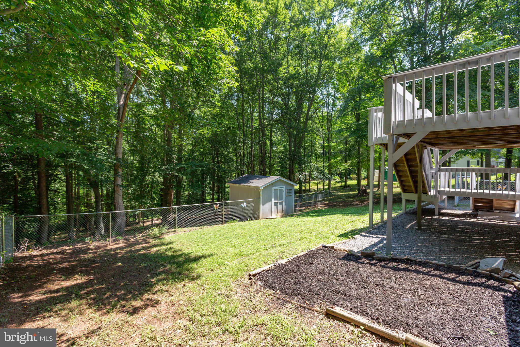 228 Cedar Ridge Drive Ruther Glen, VA 22546 - Photo 50 of 77 a view of a house with backyard and sitting area