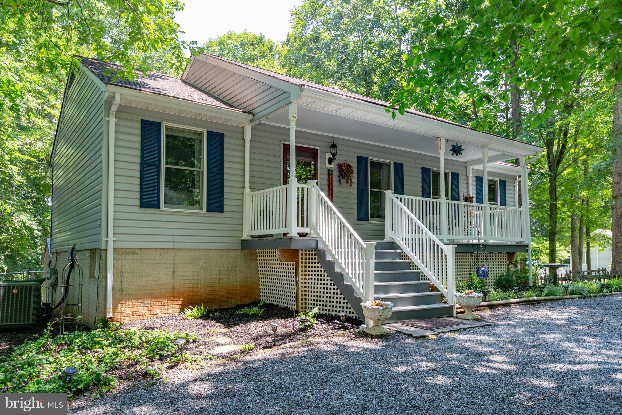 228 Cedar Ridge Drive Ruther Glen, VA 22546 - Photo 60 of 77 a front view of a house with a yard