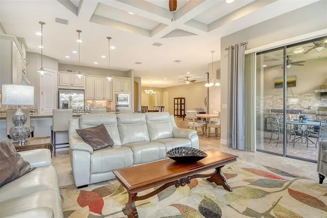 a yellow house with flower garden in front of it