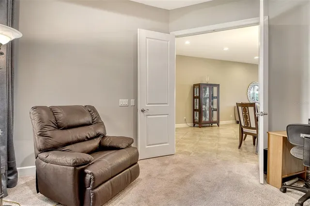 an aerial view of residential houses with outdoor space and swimming pool
