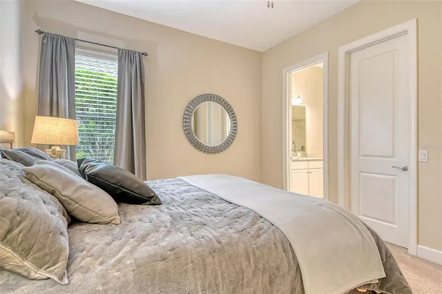 a very nice looking living room with a large dining table and a large window with garden view