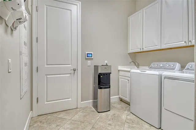 a view of a patio with table and chairs and potted plants