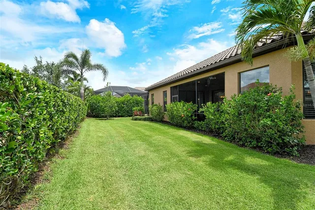 a view of a swimming pool with a table and chairs