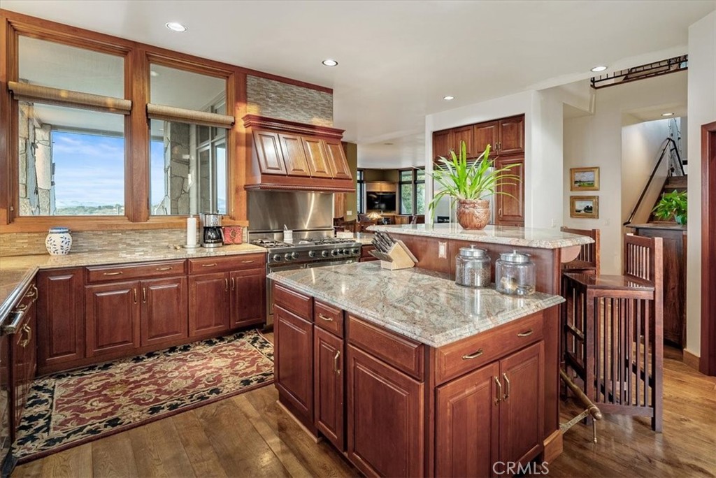 76346 Bryson Hesperia Road Bradley, CA 93426 - Photo 11 of 58 a kitchen with stainless steel appliances granite countertop a sink stove and cabinets