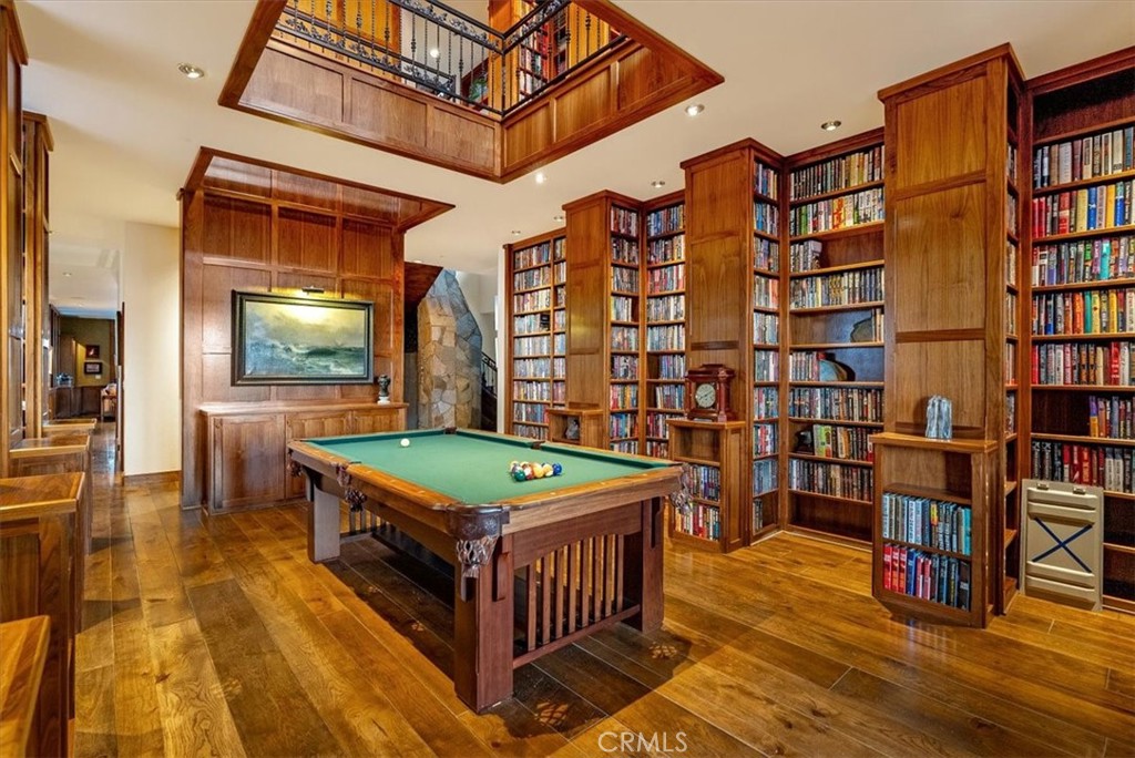 76346 Bryson Hesperia Road Bradley, CA 93426 - Photo 14 of 58 a room with bookshelf and wooden table