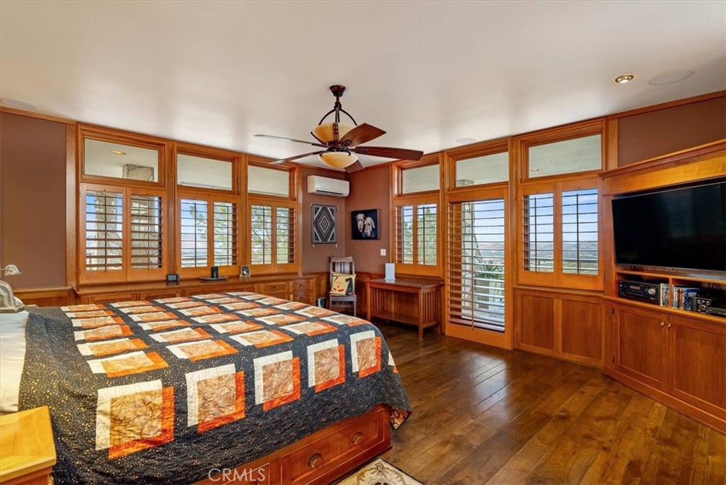 76346 Bryson Hesperia Road Bradley, CA 93426 - Photo 21 of 58 a bedroom with a bed and a flat screen tv