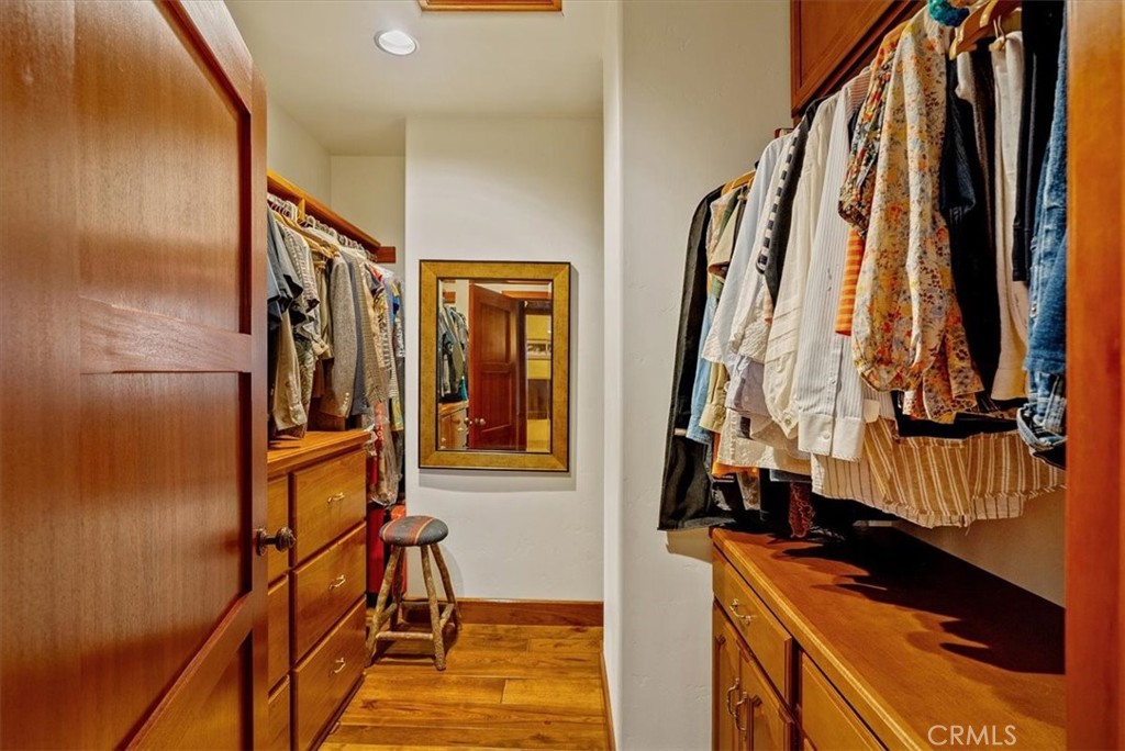 76346 Bryson Hesperia Road Bradley, CA 93426 - Photo 24 of 58 a view of walk in closet with clothes and shoes