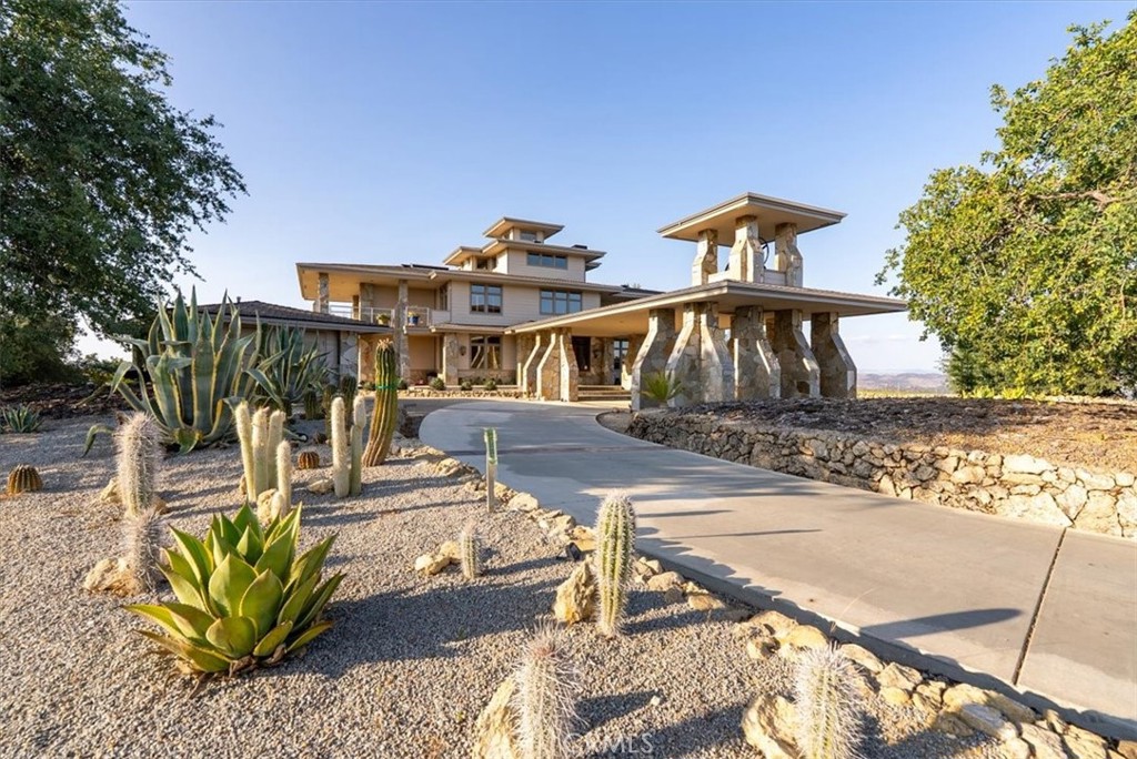 76346 Bryson Hesperia Road Bradley, CA 93426 - Photo 43 of 58 a view of a house with swimming pool and sitting area