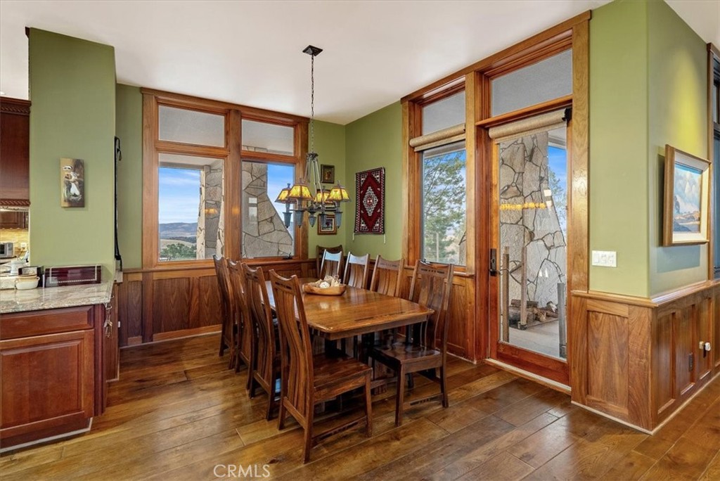 76346 Bryson Hesperia Road Bradley, CA 93426 - Photo 10 of 58 a view of a dining room with furniture window and wooden floor