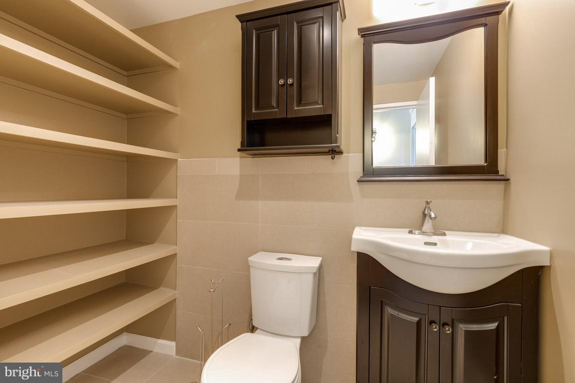 292 M Street Southwest, Unit 292 Washington, DC 20024 - Photo 20 of 29 Renovated Basement powder w/ tons of storage