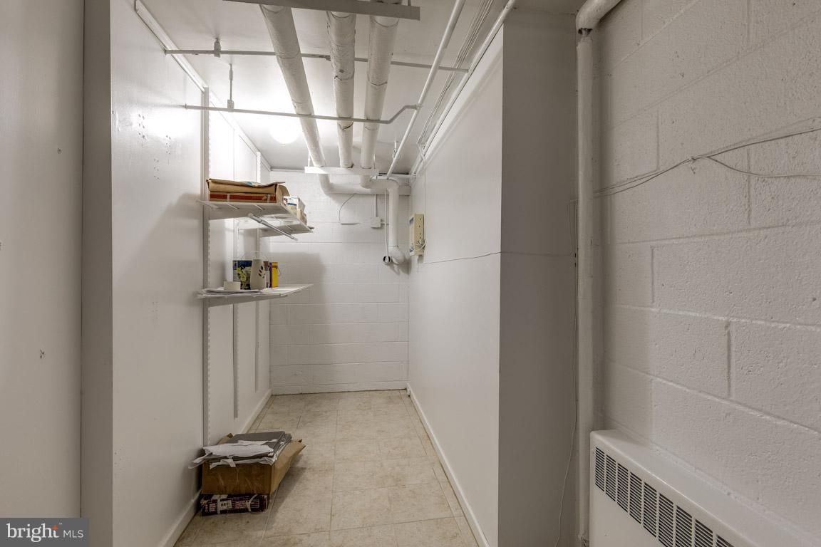 292 M Street Southwest, Unit 292 Washington, DC 20024 - Photo 25 of 29 Basement storage area near washer/ dryer