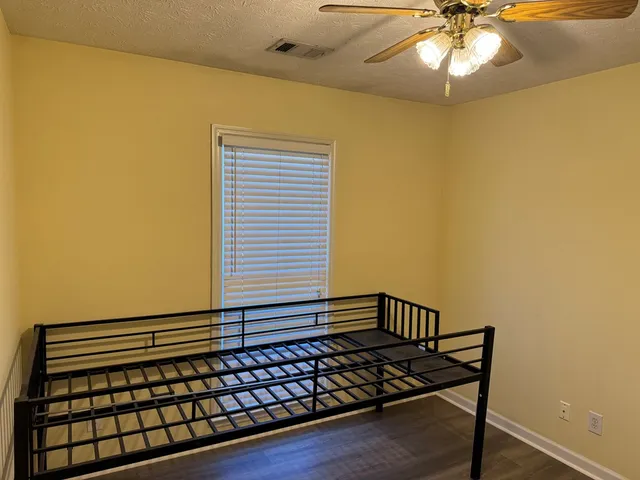 a view of a wooden floor and windows