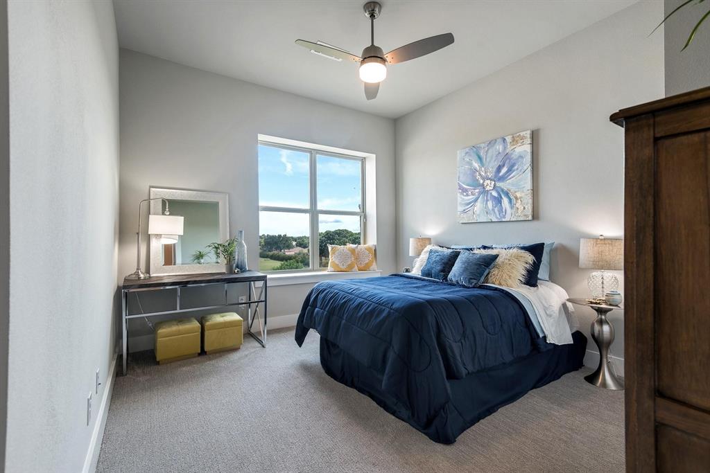 770 North Plano Road, Unit 303 Richardson, TX 75081 - Photo 16 of 26 This room features a ceiling fan with integrated lighting, a large window providing views of the landscape, and carpeted flooring