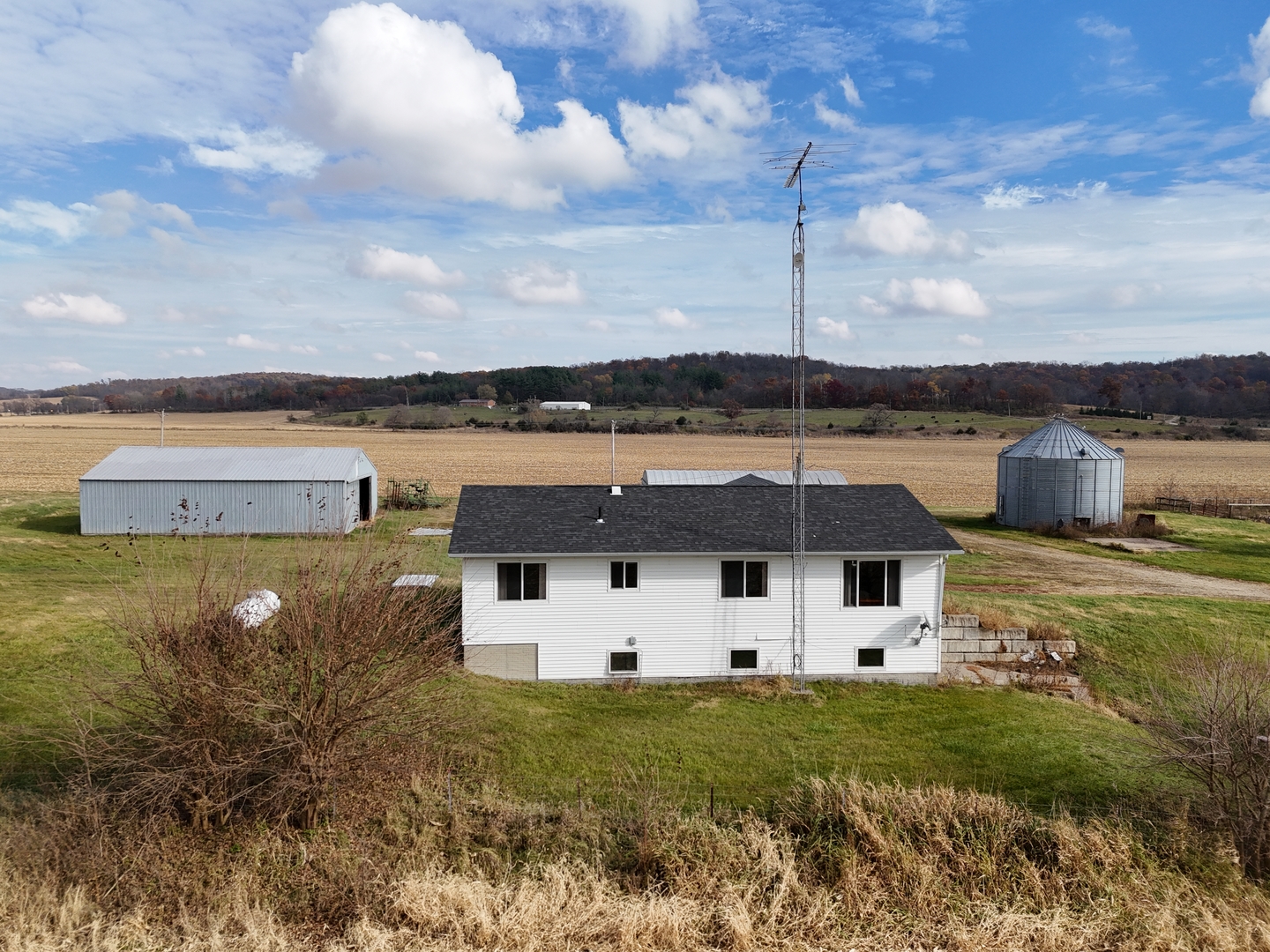 6977 South Elmoville Road Stockton, IL 61085 - Photo 7 of 14 a view of a house with a yard
