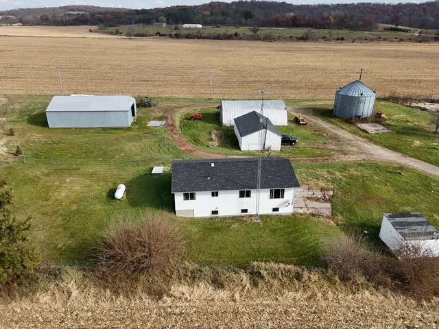 an aerial view of a house with garden space