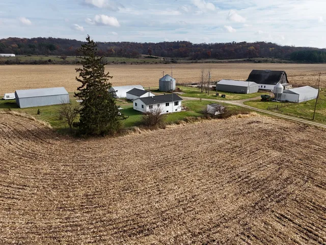 a view of a lake with couches and city view