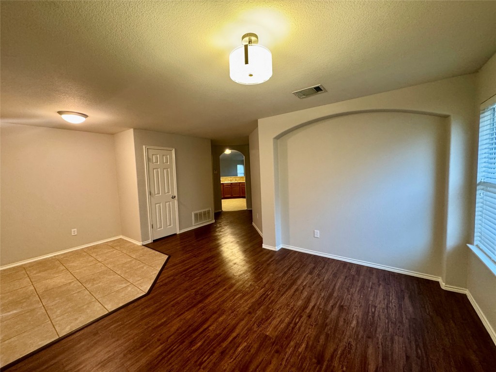 205 Bluebonnet Trail Leander, TX 78641 - Photo 3 of 22 wooden floor in an empty room with a window