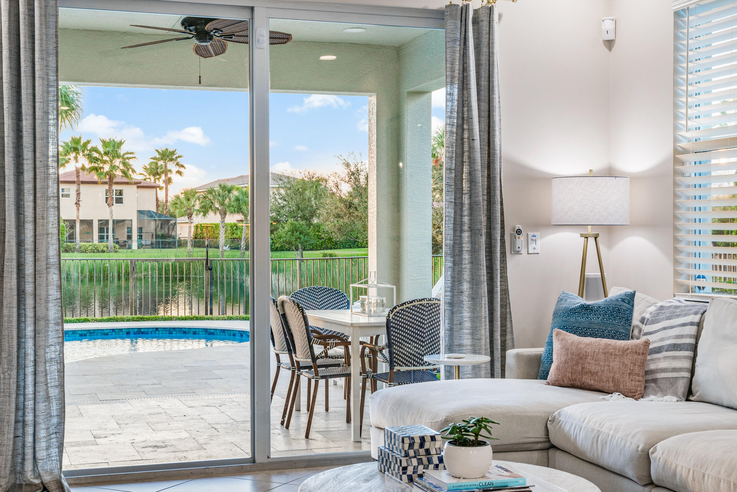 237 Porgee Rock Place Jupiter, FL 33458 - Photo 21 of 47 a living room with furniture and a floor to ceiling window
