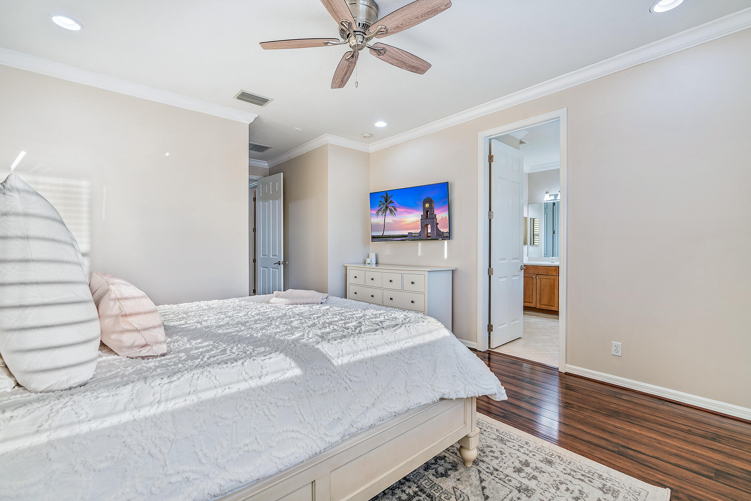 237 Porgee Rock Place Jupiter, FL 33458 - Photo 24 of 47 a bedroom with a bed and a flat screen tv