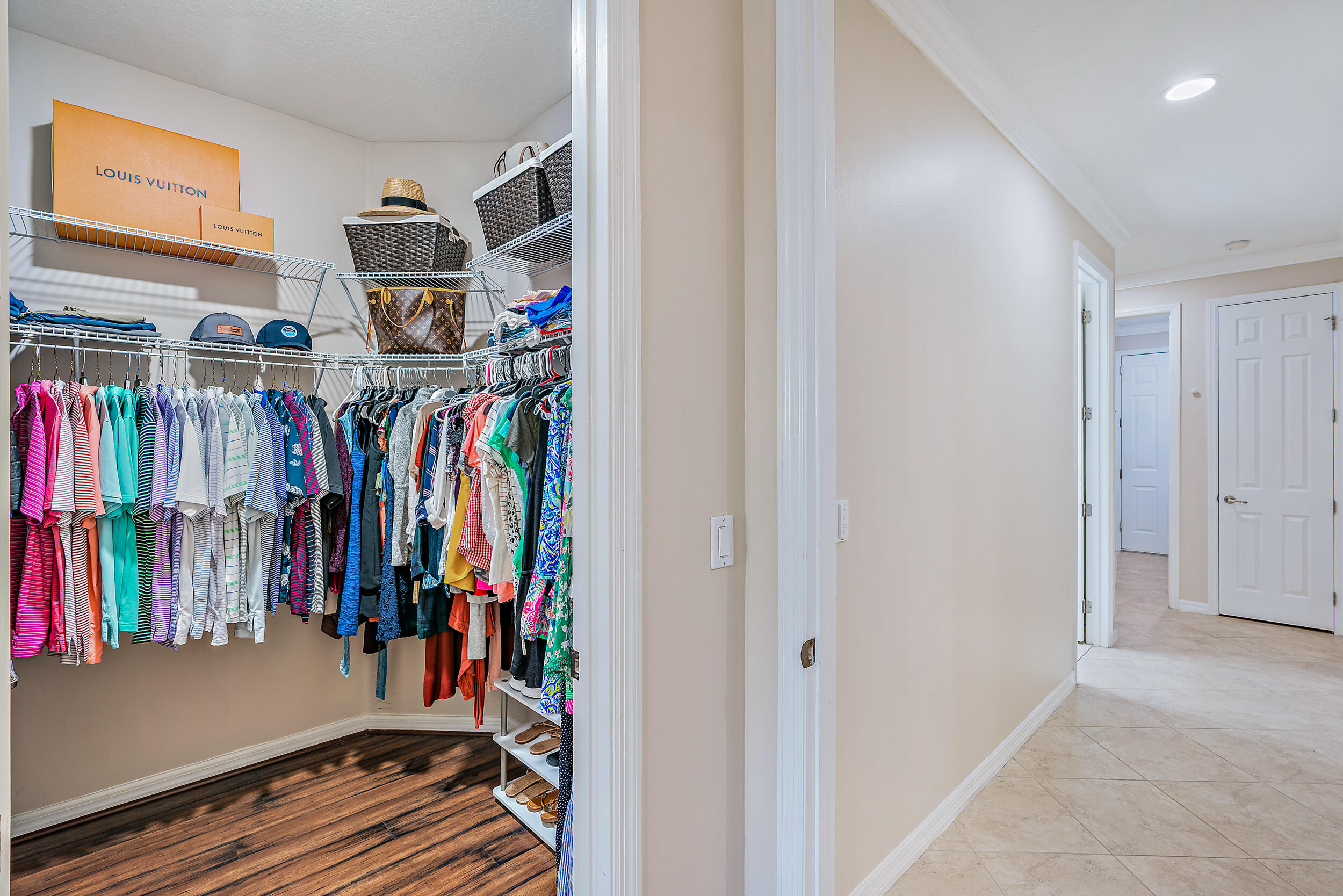237 Porgee Rock Place Jupiter, FL 33458 - Photo 25 of 47 a view of walk in closet with clothes