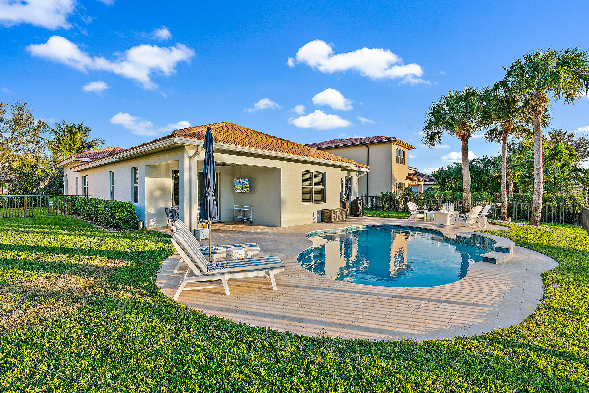 237 Porgee Rock Place Jupiter, FL 33458 - Photo 38 of 47 a view of a house with swimming pool and a yard