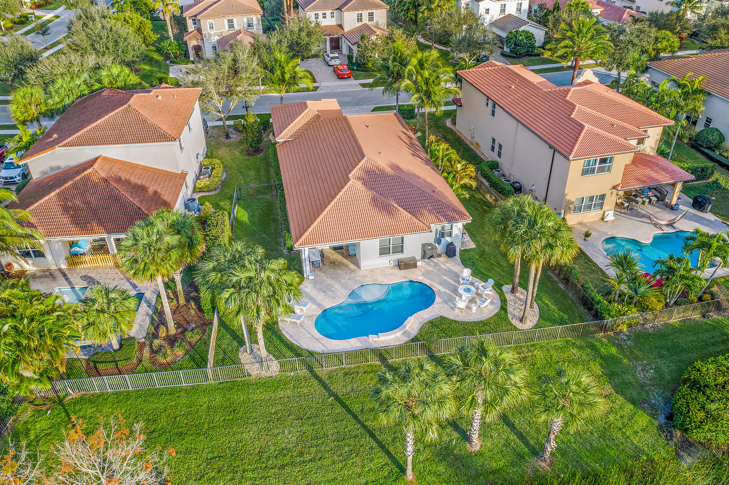 237 Porgee Rock Place Jupiter, FL 33458 - Photo 40 of 47 an aerial view of residential houses with outdoor space and swimming pool