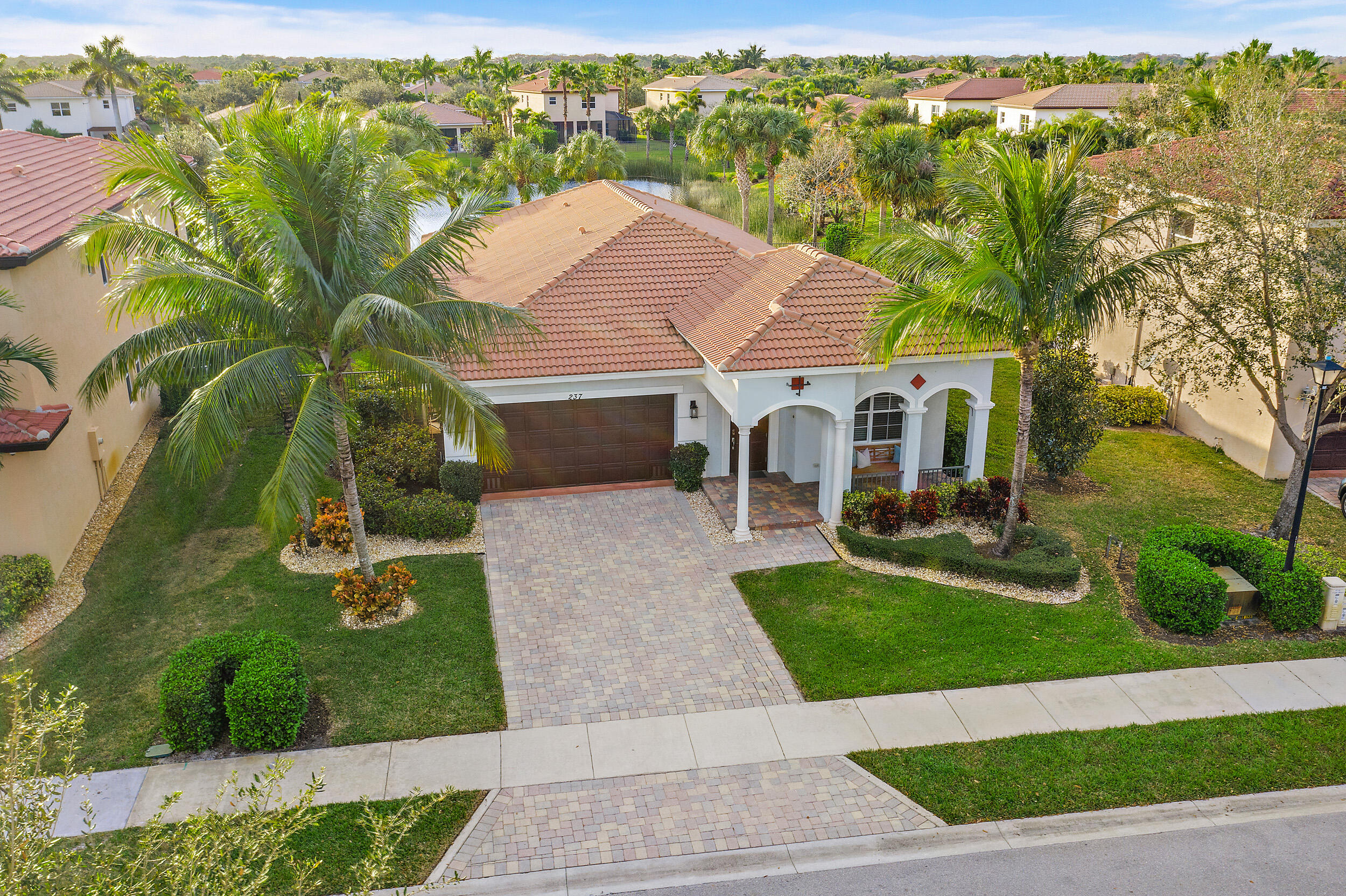 237 Porgee Rock Place Jupiter, FL 33458 - Photo 42 of 47 a aerial view of a house with garden