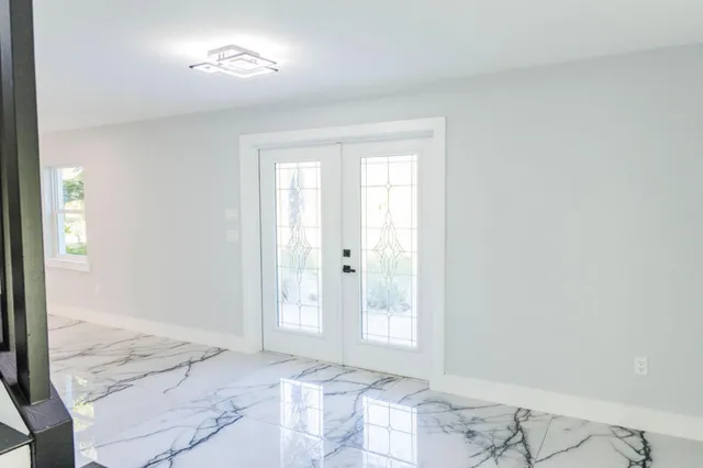 a view of an empty room with a window