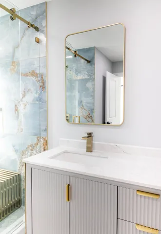 a bathroom with a sink and a mirror