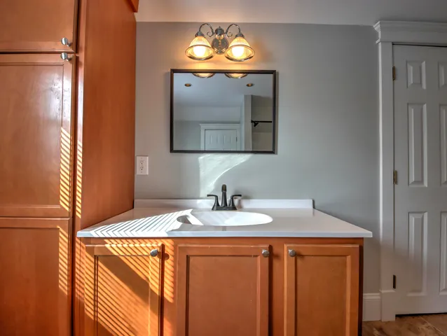 a bathroom with a sink and a mirror