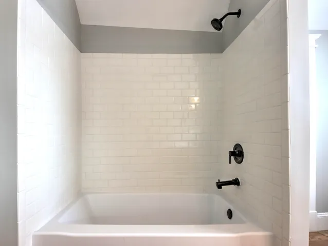 a close up of a bathtub in a bathroom
