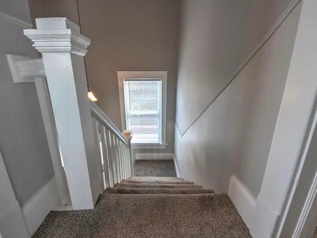 a view of a room with a large window