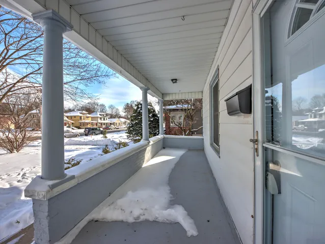 a large white building with glass door