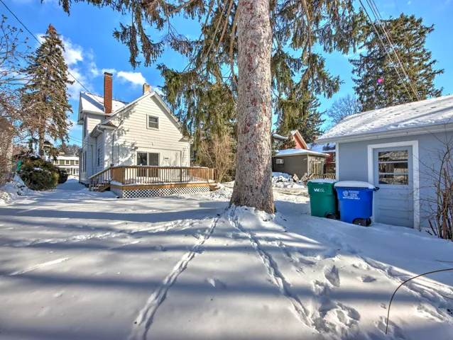 a view of a house with a tree