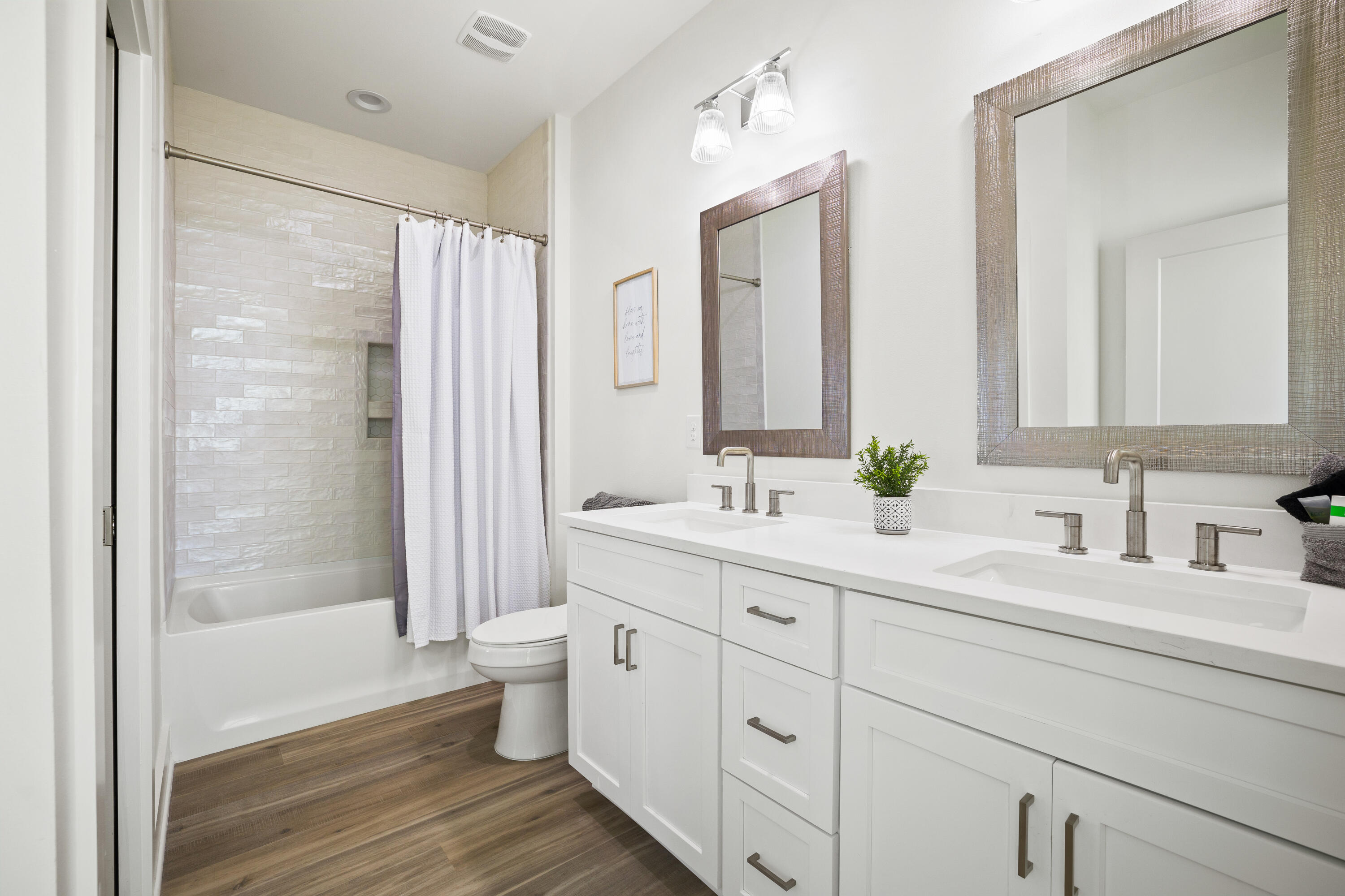7 Lake Street Miramar Beach, FL 32550 - Photo 15 of 37 a bathroom with a double vanity sink toilet and shower