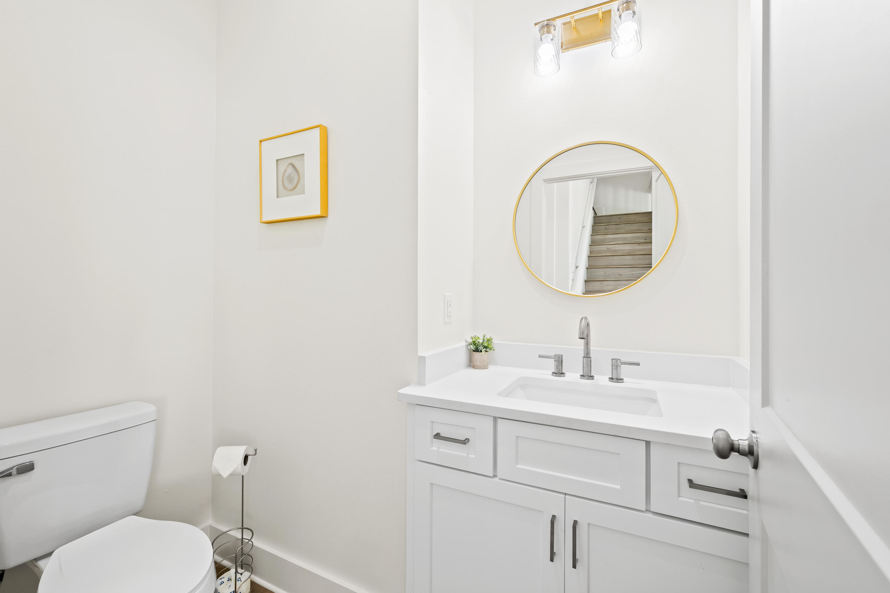 7 Lake Street Miramar Beach, FL 32550 - Photo 20 of 37 a bathroom with a sink a toilet and a mirror