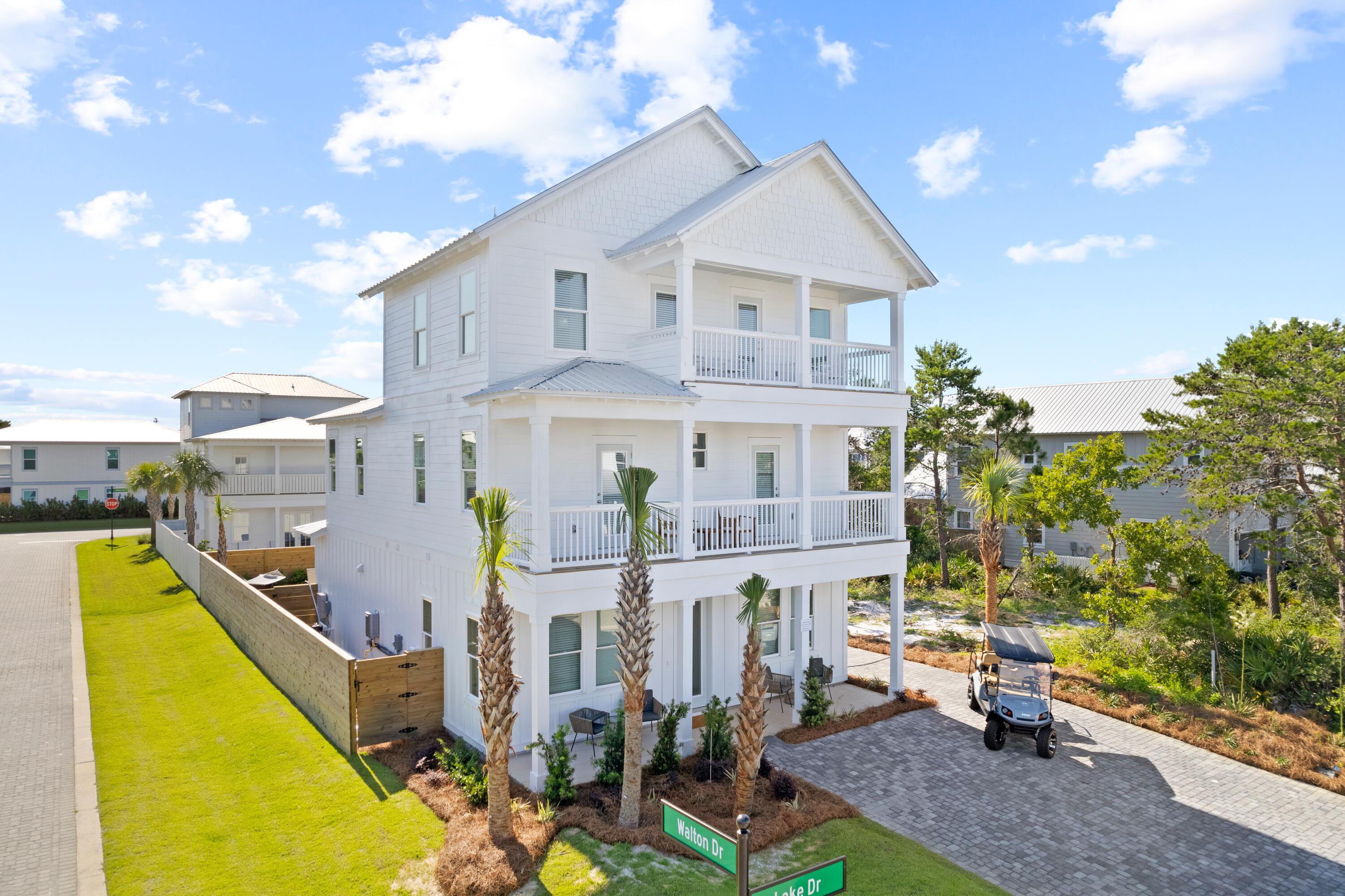 7 Lake Street Miramar Beach, FL 32550 - Photo 2 of 37 a front view of house with yard and trees in the background