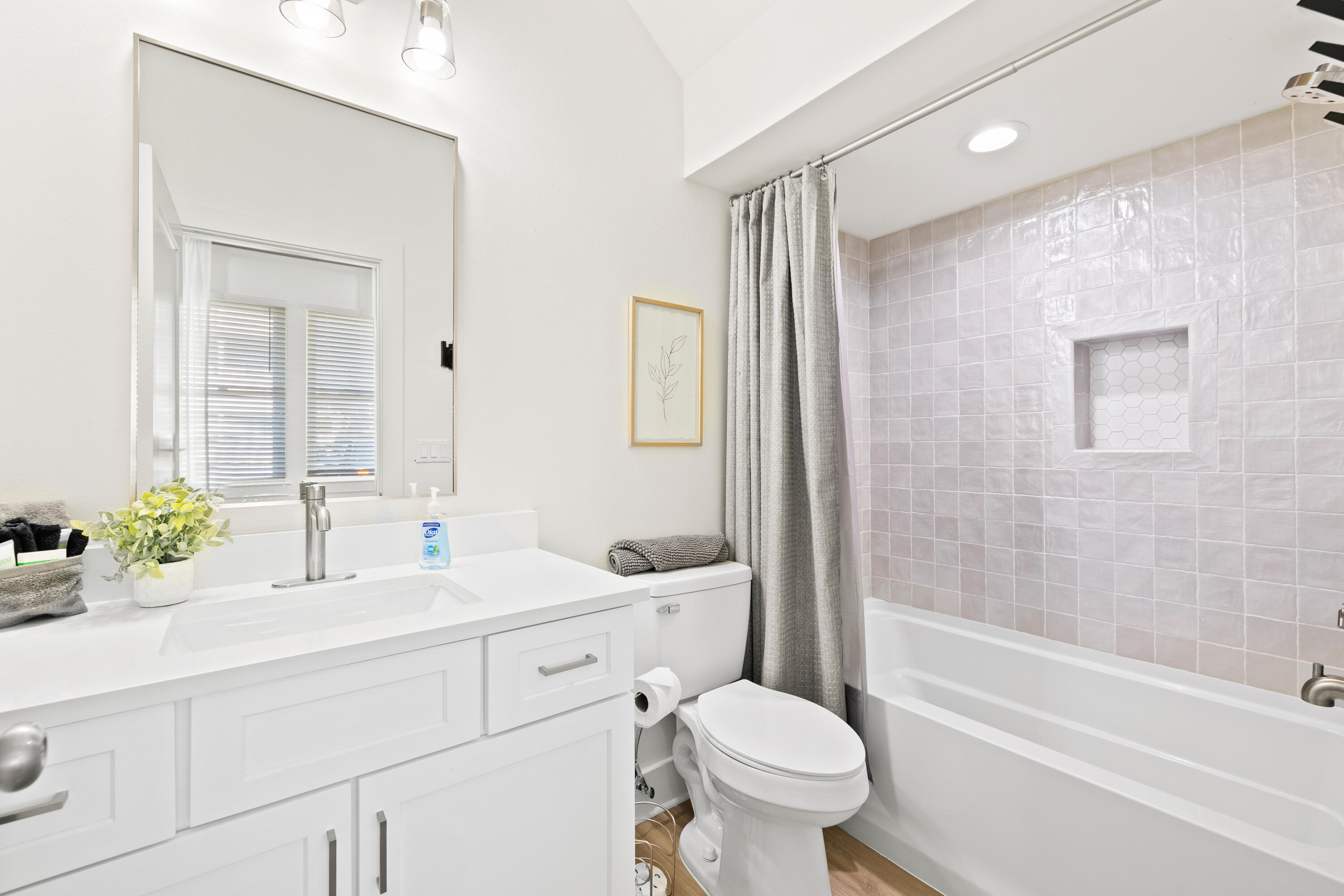 7 Lake Street Miramar Beach, FL 32550 - Photo 22 of 37 a bathroom with a double vanity sink toilet mirror and bathtub