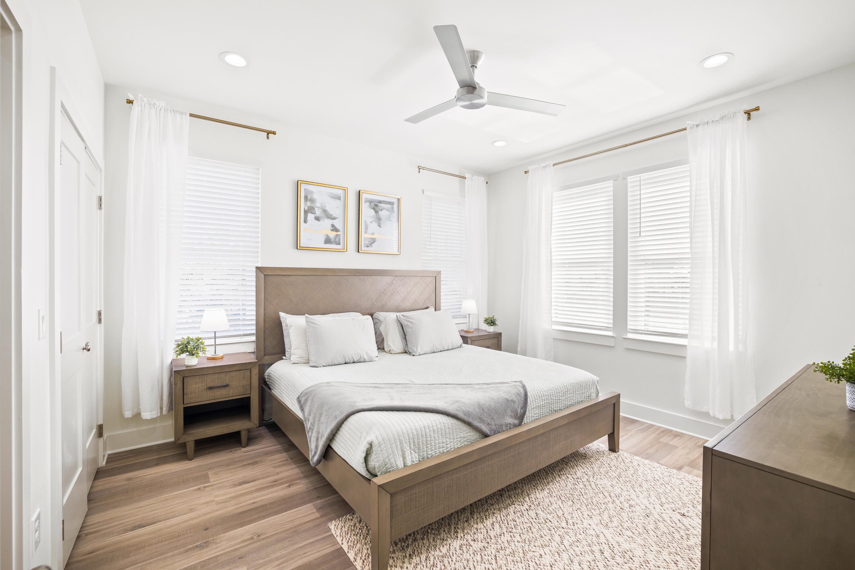 7 Lake Street Miramar Beach, FL 32550 - Photo 25 of 37 a bedroom with a large bed and a chandelier