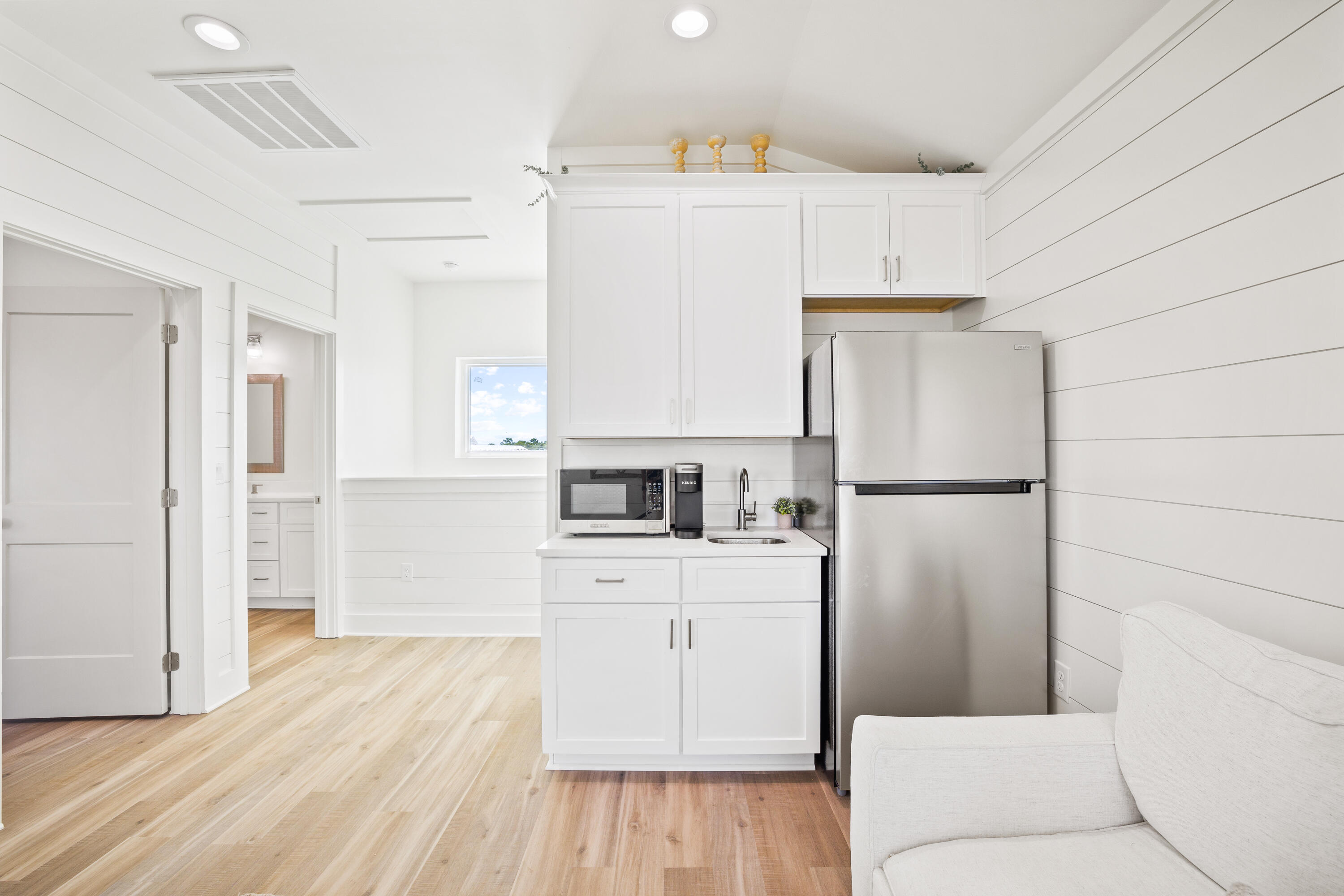 7 Lake Street Miramar Beach, FL 32550 - Photo 34 of 37 a kitchen with a refrigerator a stove top oven and white cabinets