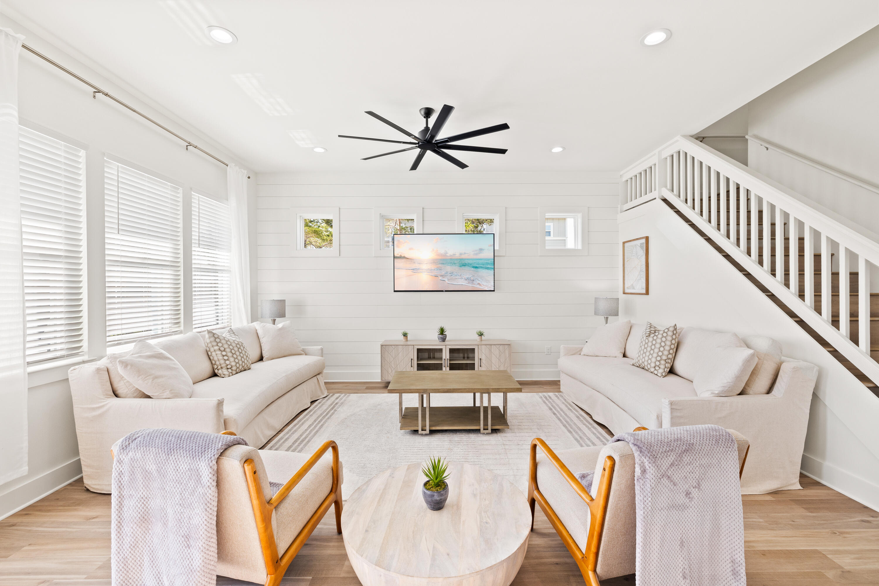 7 Lake Street Miramar Beach, FL 32550 - Photo 6 of 37 a living room with furniture a ceiling fan and a large window