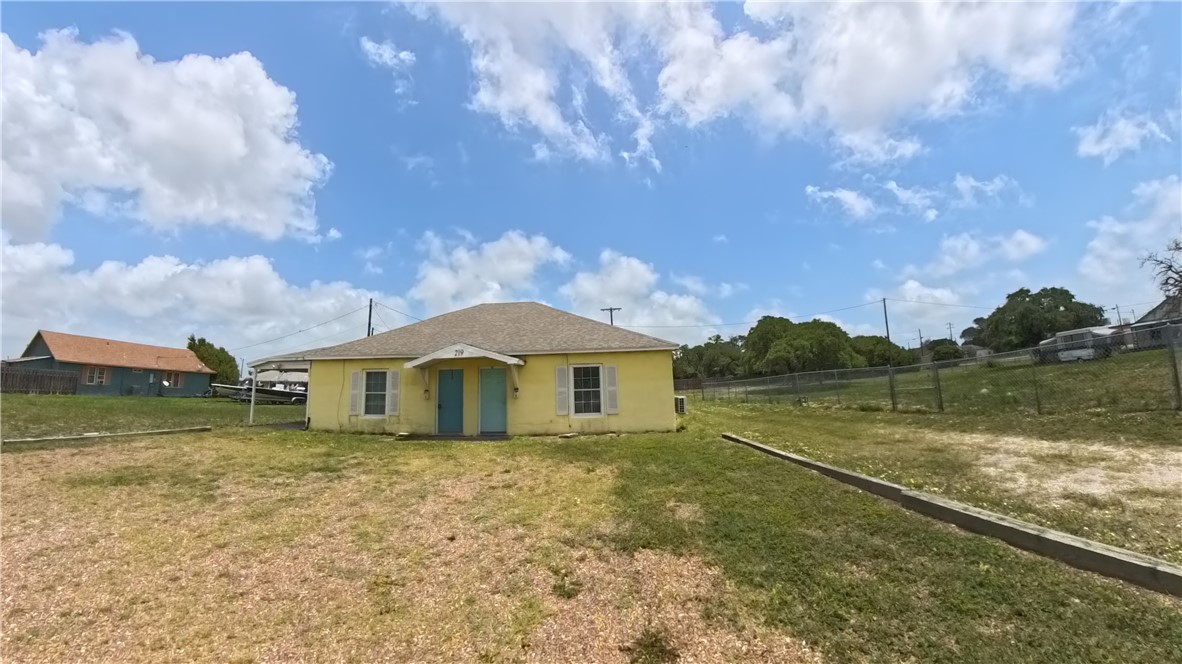 219 South 7th Street, Unit B Aransas Pass, TX 78336 - Photo 1 of 9 a view of a house with a yard