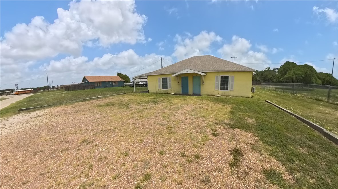 219 South 7th Street, Unit B Aransas Pass, TX 78336 - Photo 2 of 9 a view of a house with a yard