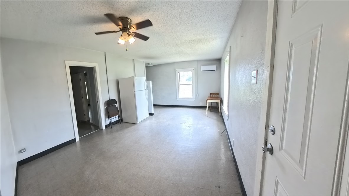 219 South 7th Street, Unit B Aransas Pass, TX 78336 - Photo 3 of 9 a view of a livingroom with a ceiling fan